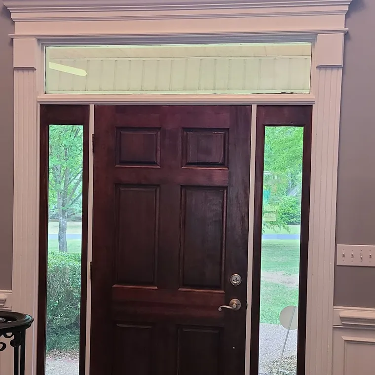New stained front door with sidelights and custom interior trim